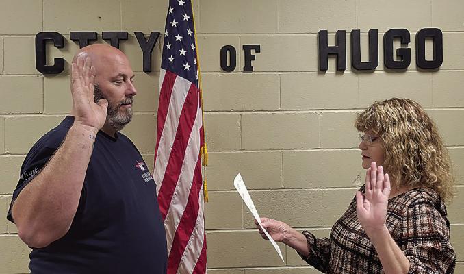 Running unopposed during the April 4 election was Ward 1 incumbent Josh Armes. He is pictured with city clerk Debra Searcy during the swearing-in ceremony held last Friday.