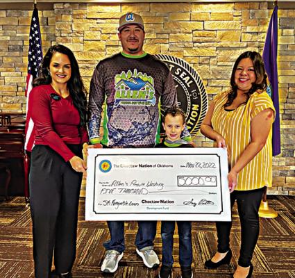 From left to right: Julie Arrieta, Choctaw Nation small business advisor; Anthony Allen, owner of Allen’s Pressure Washing, Emmett Allen and Courtney Wesley, Choctaw Nation small business advisor. Photo Courtesy / Choctaw Nation