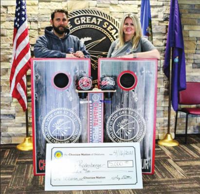 RIGHT: CODY RODENBERGER AND TIFFANY DAVIDSON, co-owners of TC Boards accepting the $5,000 Forgivable Loan. Photo Courtesy / Choctaw Nation