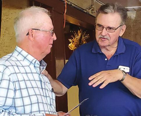 FOR THE HORSES — Tulsan Rich Stephens enjoys a moment talking with Bryant Rickman, of Hugo, about a subject they both love and enjoy — Spanish Mustangs... during a recent luncheon in Hugo. Photos Courtesy: Dianne Weeks