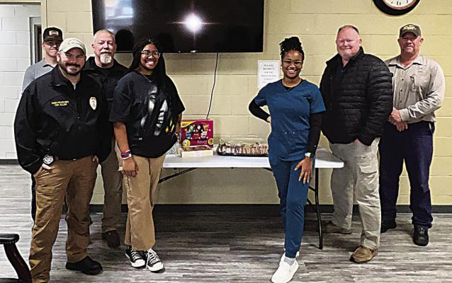THe Hugo HigH scHool leo club, represented by president Amya Savage and director Jakariyah Robinson, provided lunch on Dec. 6 for the Hugo Fire Department and Hugo Police Department. The Leo Club wanted to show their appreciation to the firefighters and law enforcement for their many hours of dedicated service to the Hugo community.