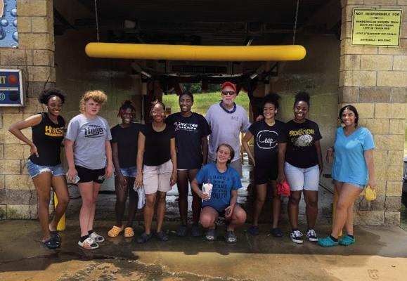 The Hugo Lady Buffs (basketball) held their first fundraiser of the year on July 30 with the help of Buffalo Bay owner Remy Tholen. Pictured above are Tholen, Demiya Akins, Keighanna Kelley, Zariah Ware, Schuynasti Starlin, Keshawna Scroggins, Calista Kelley, Tanea Johnston, Kelicia Cook and Kamarianna Coleman, who all participated in the car wash. The Lady Buffs will soon be out and about around Hugo selling candy bars as their next fundraiser. Hugo News Photos / Kelli Stacy