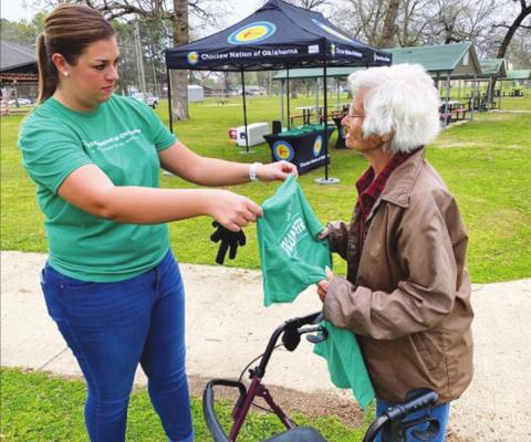 SAMANTHA J. SNEAD presents “Granny” Miller with a t-shirt for her continued efforts of trash pickup in Valliant. Known as the “Town Granny,” Miller turned 93 on April 15. Photo Courtesy / Charles Clark, Choctaw Nation