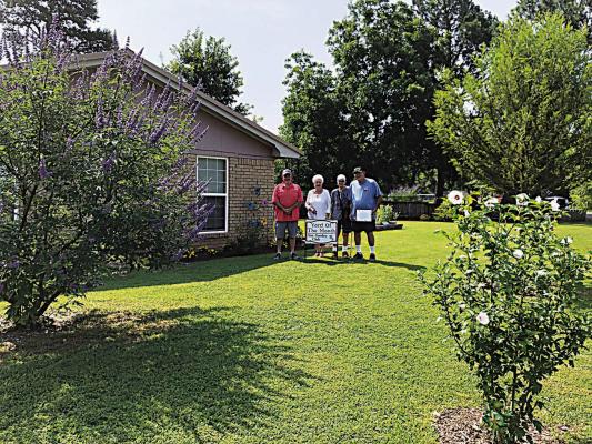 Iris Garden Club Yard of the Month for June were Robert and Judy Van Winkle at 226 Dorothy Orton in Jaymac addition. The beautiful yard features shrubs, trees, flowers and ornamentation and is beautifully maintained. Pictured are Rick Lowrance and Sammye Thacker with the couple