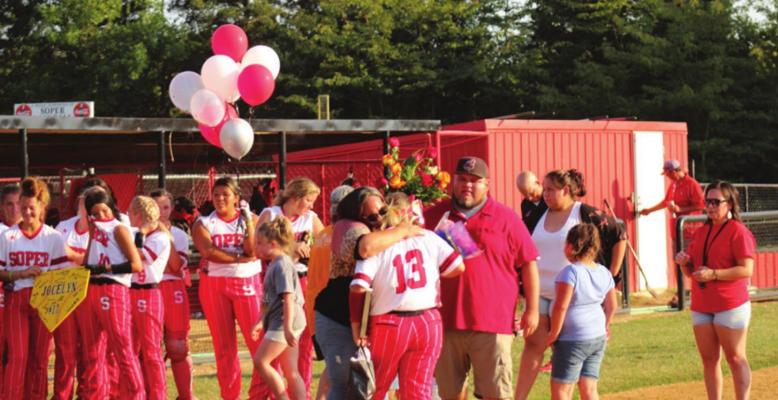 JOCELYN RICE is congratulated by her parents and teammates during Senior Night festivities held by the Soper Lady Bears last week. Brian Moore Photo