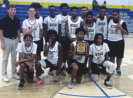 THE HUGO MIDDLE SCHOOL EIGHTH GRADE BUFFALOES remain undefeated at 12-0 after wiping out the competition in the Antlers Bobby Harris Invitational Tournament last week. Members of the team include: (back, l-r) Coach Tanner Trent, Weston Dunn, Keldon Cochran, Kevin Wallace, Malakhai Edwards, Azarian Ireland, Anthony Thompson, Ar’Moni Biggers, Quincy Shelton, Kyza’Juan Green. (Front, l-r) Juwan Johnson, Makhi Edwards, Lorenzo King Jr., Jakabrian Tarver. Photo Contributed