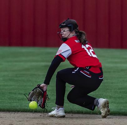 SOPER’S SHY’ANNE WOLFE makes a great back-handed stop from her short stop position to make a key out against the Hugo Lady Buffaloes during last week’s home game at Soper. HUGO NEWS PHOTO / Bobby Hamill
