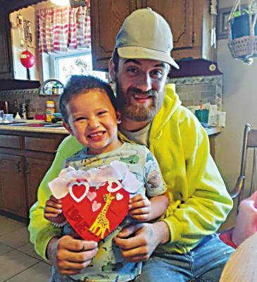 RIGHT: STUDENTS AT BOSWELL 2 Head Start recently celebrated dad’s day at home, making a heart craft.