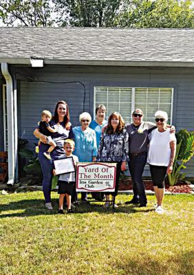 Iris Garden Club Yard of the Month was awarded to Spencer and Shyla Bacon at 707 W. Oklahoma in Hugo. Pictured are Shyla and her children: Stella and July, Mary Cook, Shondell Rothmire, Shelia Kidd, Aaryn May and Sammye Thacker.