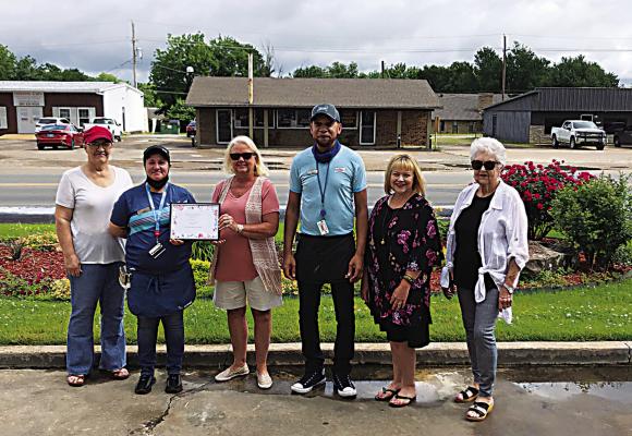 The Iris Garden Club presented a certificate of appreciation to the Sonic in Hugo to show their appreciation to them for their civic pride, their beautiful landscape, and maintenance of all the roses, shrubs and flowers. Pictured are Sonic employees and garden club members.