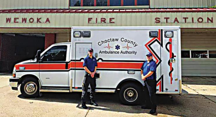 CHOCTAW COUNTY AMBULANCE Authority EMT-Basics Elijah Hubbard and Dalton Mahoney stand outside the Wewoka Fire-EMS station, where they assisted the community following a COVID-19 outbreak.