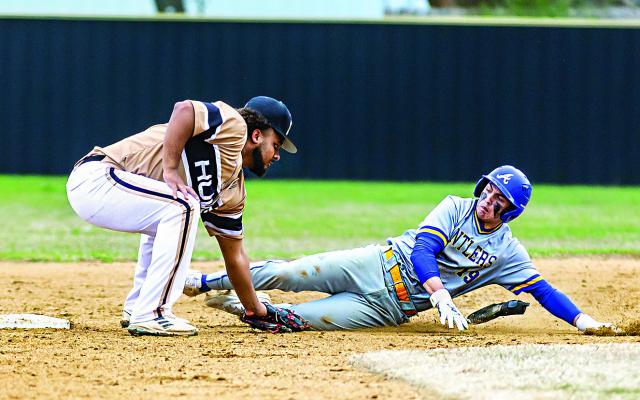 HUGO BUFFALO ADEN PARISH made it to first base in time to take the catcher’s throw and tag Antlers baserunner Kreed Jones out at second. It was one of only a few bright spots for the Buffaloes during the game, as the Bearcats came away with a 6-0 shutout. HUGO NEWS PHOTO / Bobby Hamill
