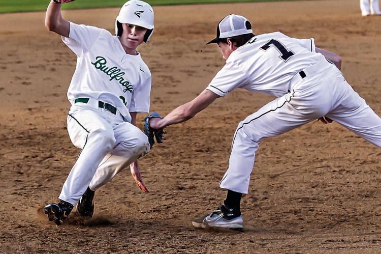 HUNTER STORY puts the tag on a Mill Creek base runner during recent baseball action on Jo Miller Field. The Tigers took the win, 3-0. HUGO NEWS PHOTO / Bobby Hamill