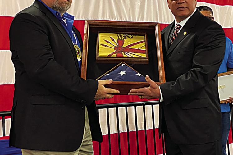 Chief Gary Batton, right, presents a thank you gift to keynote speaker, retired Oklahoma National Guard Col. Bobby Yandell Jr. during the 2022 Choctaw Veterans Day Ceremony Nov. 11 at Tvshka Homma. Photo Courtesy / Charles Clark, Choctaw Nation