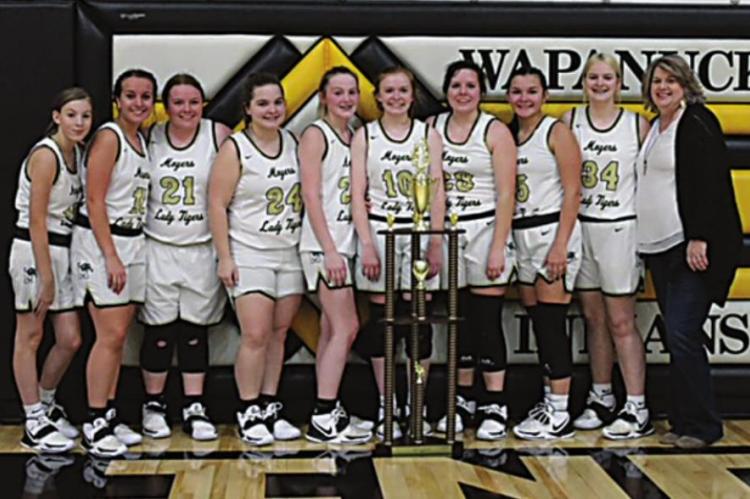 MOYERS CHAMPIONS! — Taking home the Championship Trophy from the Wapanucka Invitational Basketball Tournament this past weekend were the Moyers Lady Tigers. Members of the team pictured above (Coached by Donna Dudley) include (l-r): Kynley Lucas, Audrey Childress, Olivia Napier, Katelyn Thomas, Abby Higginbottom, Brooklyn Higginbottom, Rebecca Napier, KyeAreha Williams, and Jill Nored. (Photo Contributed.)