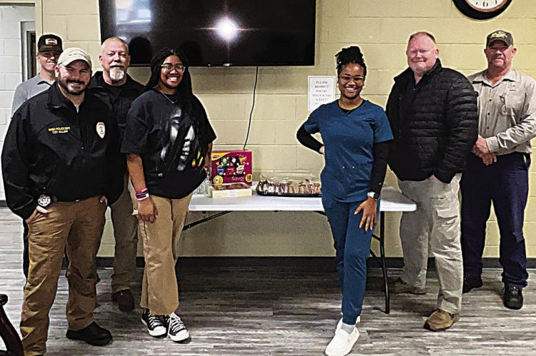 THe Hugo HigH scHool leo club, represented by president Amya Savage and director Jakariyah Robinson, provided lunch on Dec. 6 for the Hugo Fire Department and Hugo Police Department. The Leo Club wanted to show their appreciation to the firefighters and law enforcement for their many hours of dedicated service to the Hugo community.