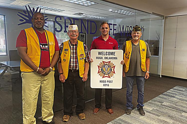 First United Bank recently donated street signs for the local VFW club. The VFW, located on Jackson St. in Hugo, holds bingo nights on Monday, Thursday and Friday each week, with early bird specials beginning at 6 p.m. Pictured from the VFW are: Donald Dangerfield, Dan O’Grady and JK Smith. Holding the sign is First United’s Gary Newberry.