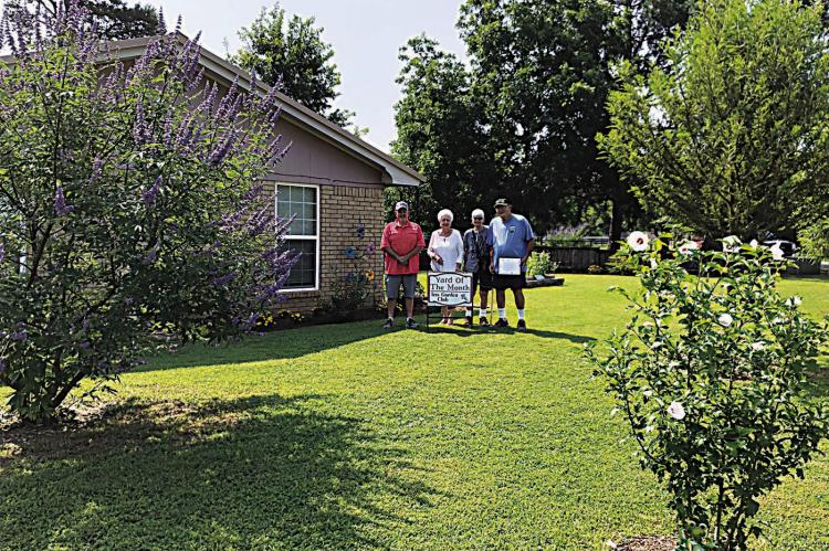 Iris Garden Club Yard of the Month for June were Robert and Judy Van Winkle at 226 Dorothy Orton in Jaymac addition. The beautiful yard features shrubs, trees, flowers and ornamentation and is beautifully maintained. Pictured are Rick Lowrance and Sammye Thacker with the couple