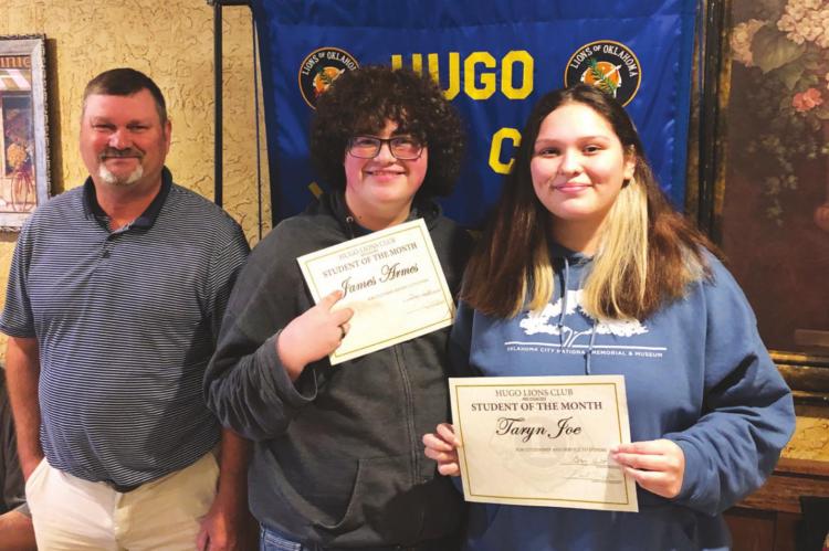 HUGO LIONS CLUB Students of the Month are James Armes and Taryn Joe, pictured with Hugo High School Principal Greg Holt.
