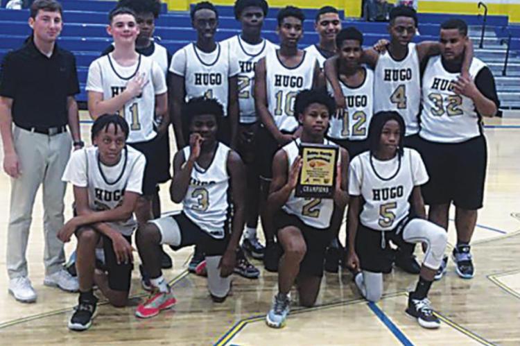 THE HUGO MIDDLE SCHOOL EIGHTH GRADE BUFFALOES remain undefeated at 12-0 after wiping out the competition in the Antlers Bobby Harris Invitational Tournament last week. Members of the team include: (back, l-r) Coach Tanner Trent, Weston Dunn, Keldon Cochran, Kevin Wallace, Malakhai Edwards, Azarian Ireland, Anthony Thompson, Ar’Moni Biggers, Quincy Shelton, Kyza’Juan Green. (Front, l-r) Juwan Johnson, Makhi Edwards, Lorenzo King Jr., Jakabrian Tarver. Photo Contributed