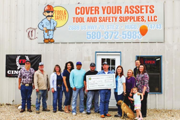 PICTURED: DANNY D. BIAS, JR., owner of CYA Tool and Safety Supplies LLC and family get presented with $5,000 forgivable loan check by Gina Hamilton, Choctaw Nation Small Business Advisor and Angel Rowland, Manager of the Choctaw Development Fund. Photo Courtesy / Choctaw Nation