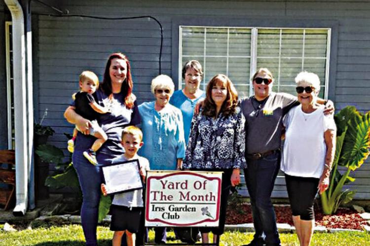 Iris Garden Club Yard of the Month was awarded to Spencer and Shyla Bacon at 707 W. Oklahoma in Hugo. Pictured are Shyla and her children: Stella and July, Mary Cook, Shondell Rothmire, Shelia Kidd, Aaryn May and Sammye Thacker.